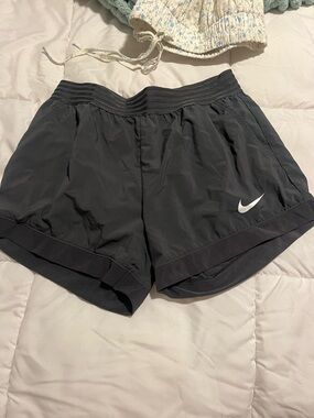 Nike Women's Dark Grey Athletic Running Shorts with White Swoosh